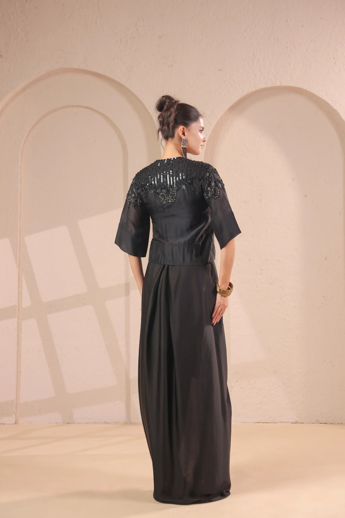 Hand emboidered jacket with bustier and drape skirt