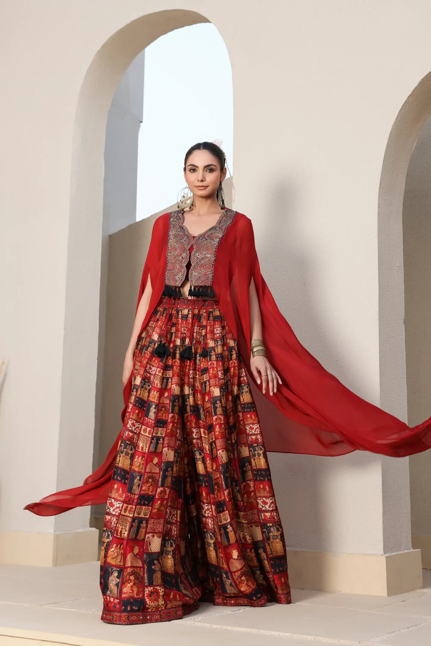 Mughal Art Printed Sharara with Heavy Embroidered Blouse And Solid Cape