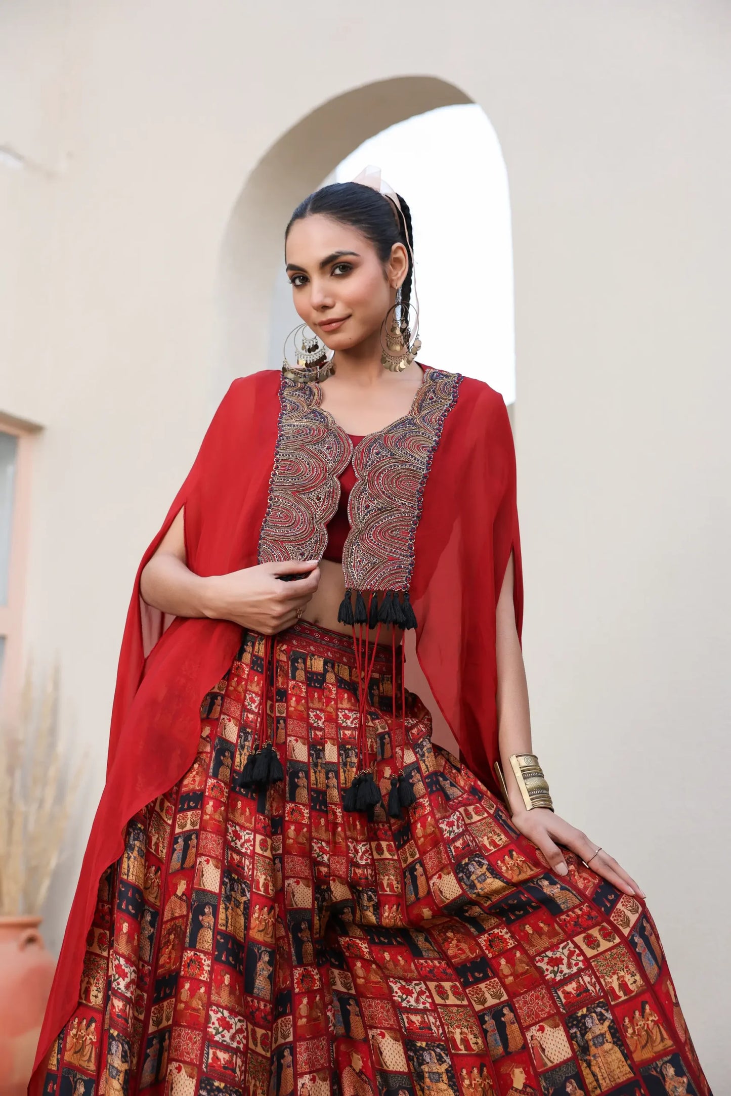 Mughal Art Printed Sharara with Heavy Embroidered Blouse And Solid Cape