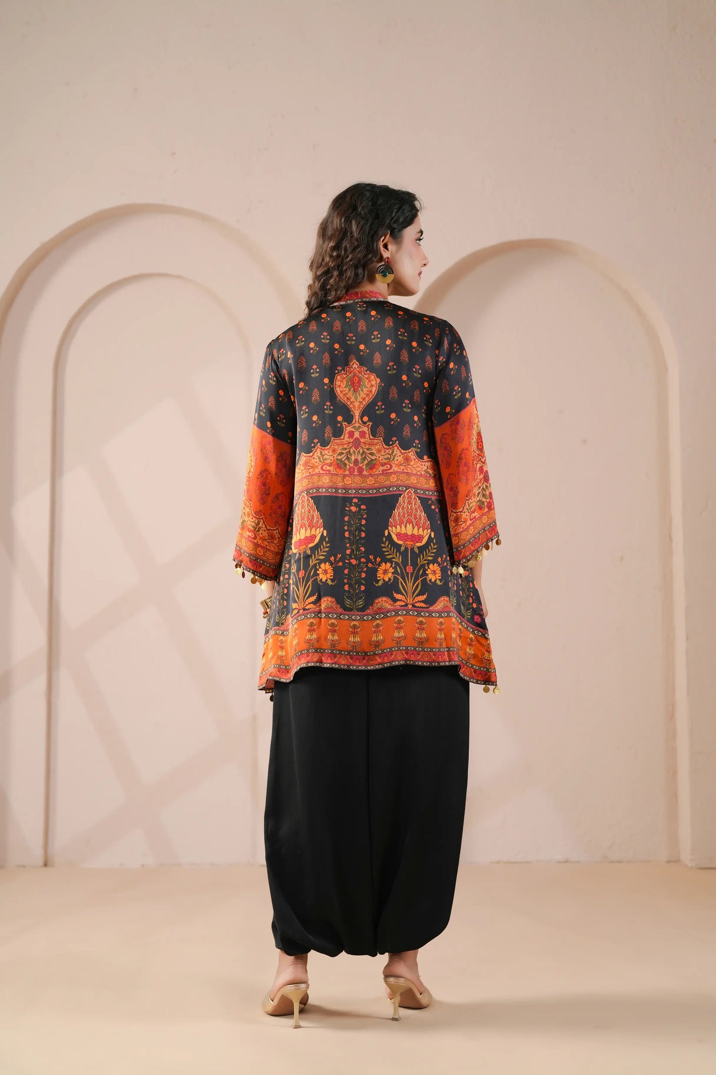 Hand Embroidered Ethnic Kurta with eye catching hemline, paired with harem pant