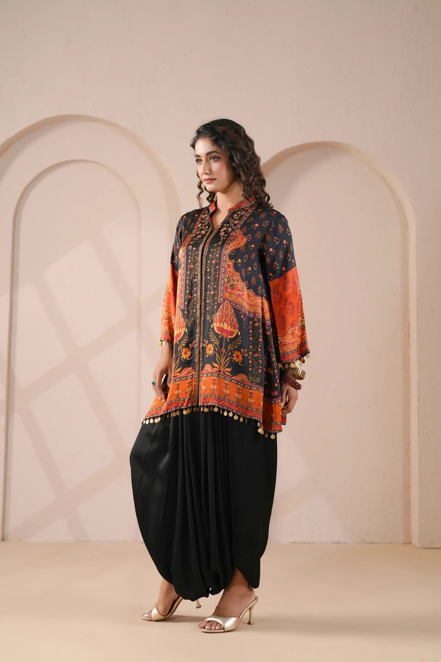 Hand Embroidered Ethnic Kurta with eye catching hemline, paired with harem pant