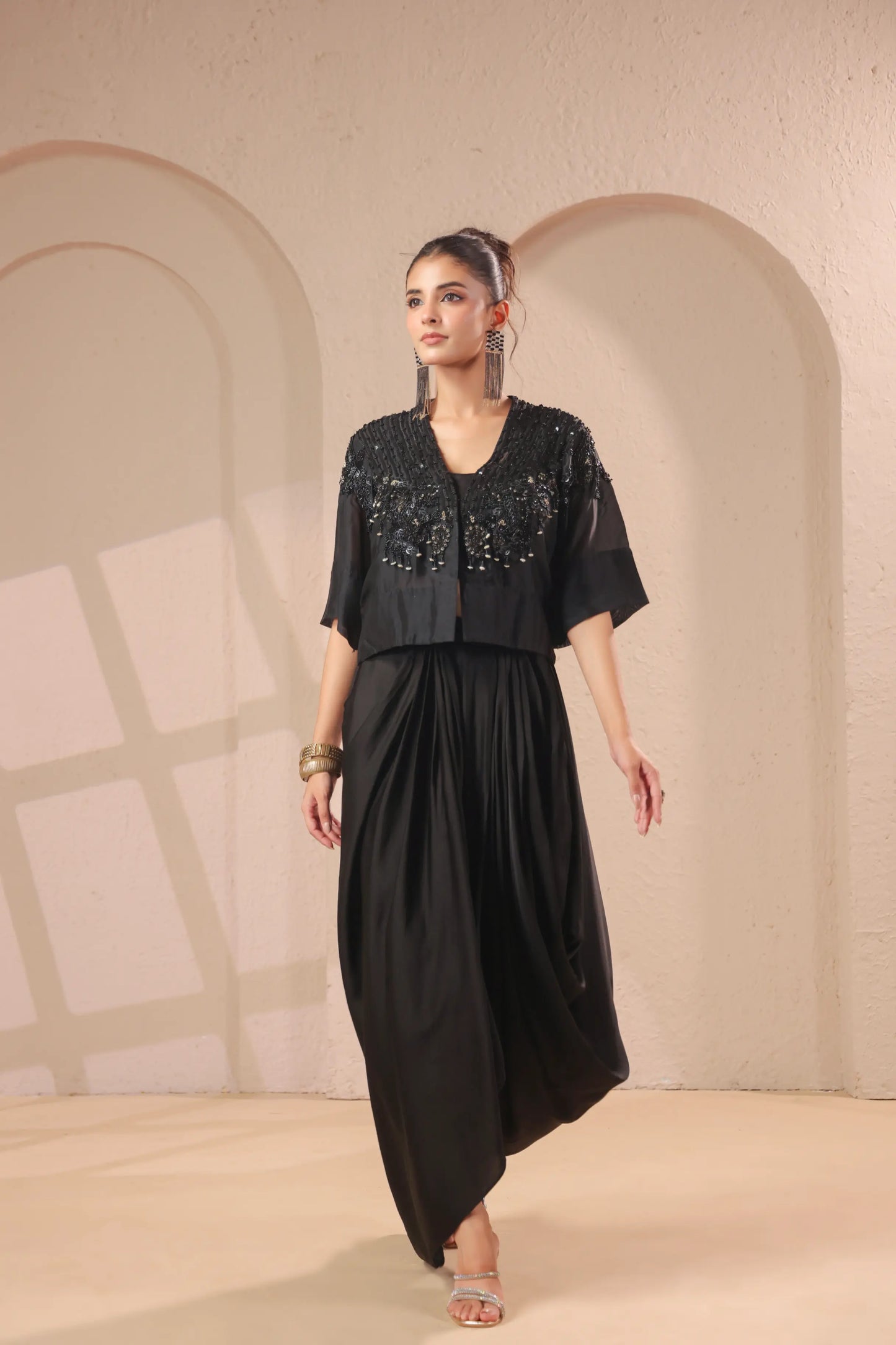 Hand emboidered jacket with bustier and drape skirt