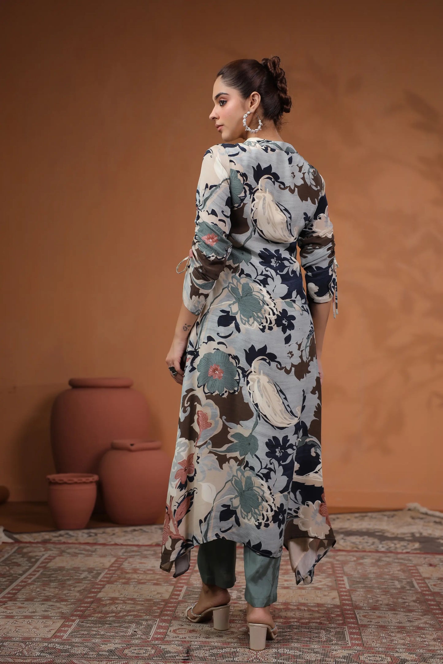 Printed Asymmetrical hemline Kurta with hand Emb. Detail
