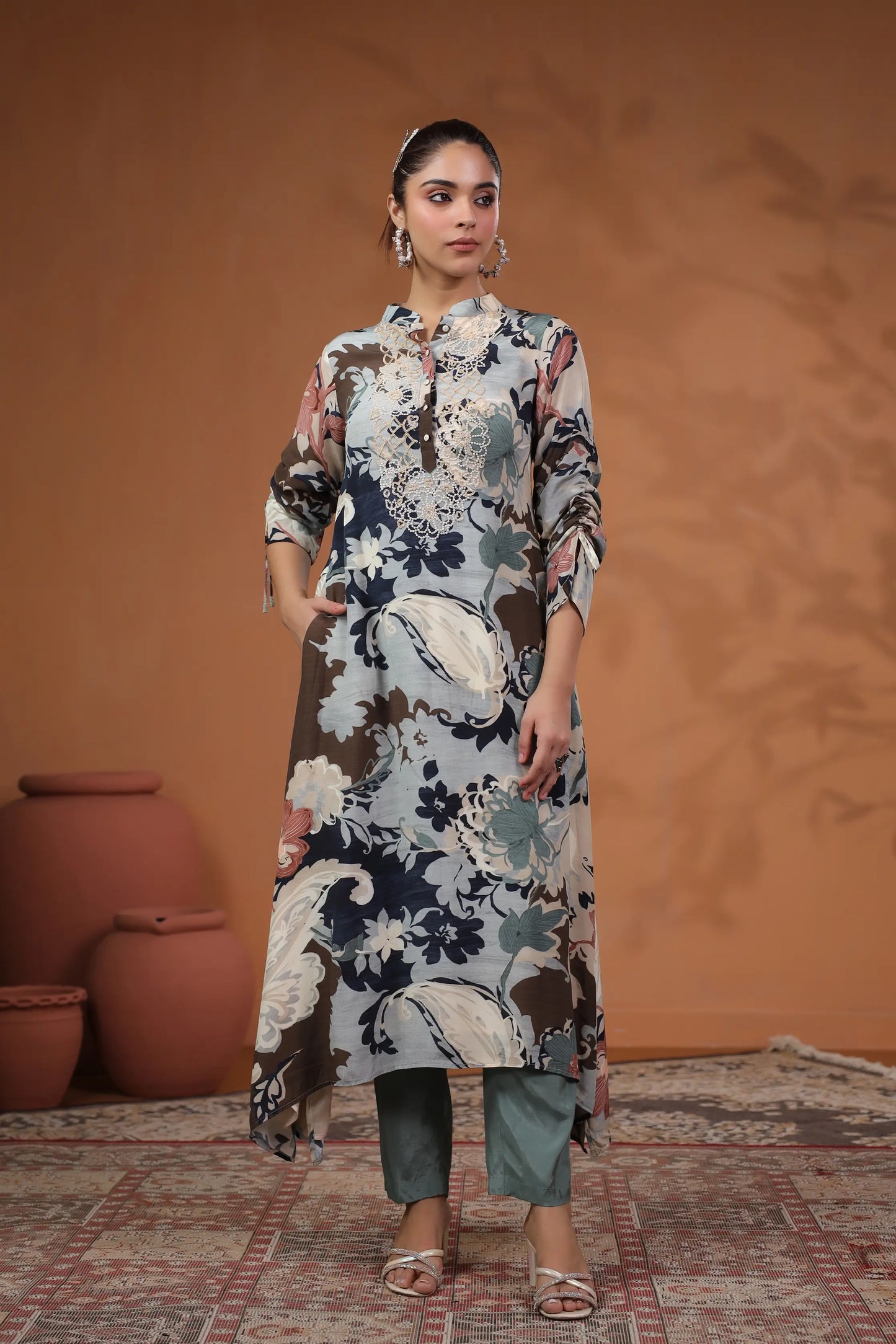 Printed Asymmetrical hemline Kurta with hand Emb. Detail