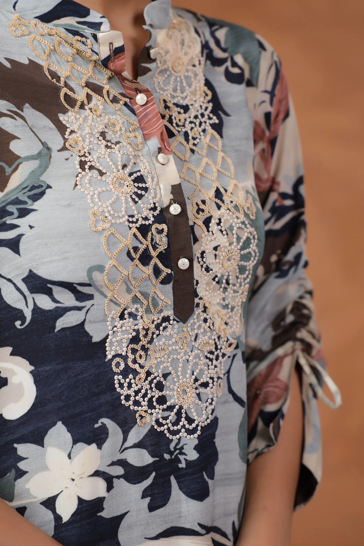 Printed Asymmetrical hemline Kurta with hand Emb. Detail