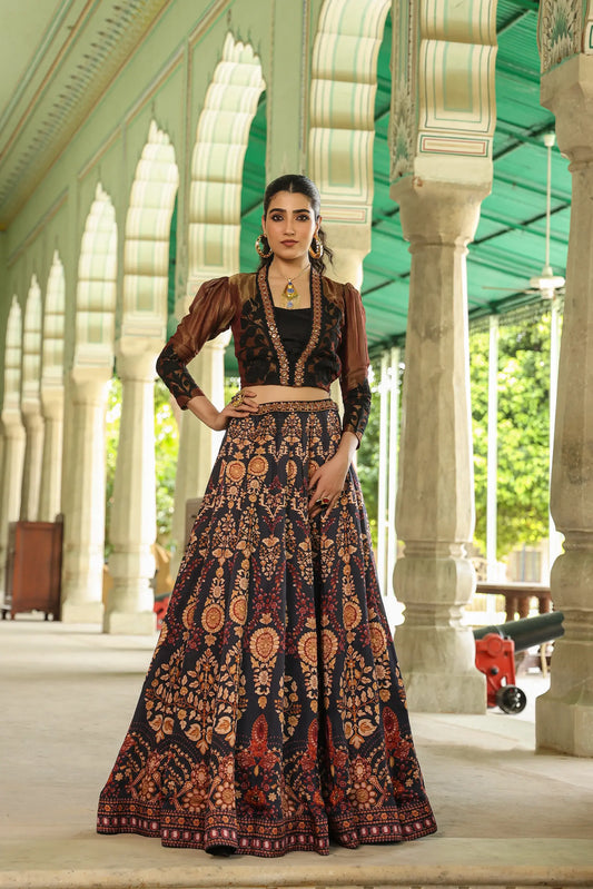 A black colour traditional print lehanga with Stylist full sleeves blouse