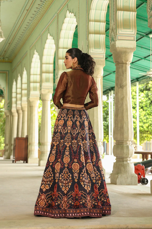 A black colour traditional print lehanga with Stylist full sleeves blouse